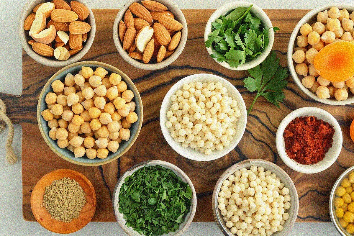 Fresh ingredients for moroccan couscous recipes arranged in flat lay composition